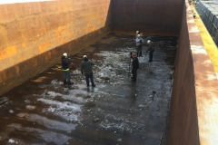 C&B associates cleaning the bottom of a barge at its Hebron, KY facility