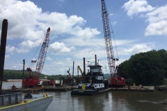 C&B’s mobile cranes on work barges, assisting C&B’s dry dock facility