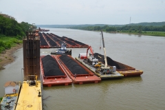 The M/V JL BRADEN performing harbor services at a coal plant while a C&B work barge prepares to reclaim coal